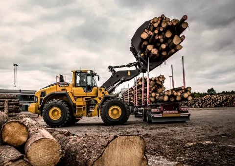 wheel loader moving lumber