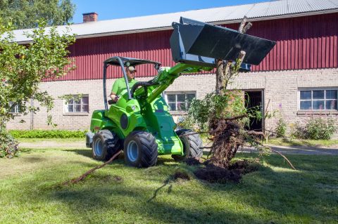 small heavy equipment rental machine working in a yard