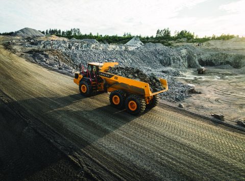 Volvo articulated hauler carrying boulders