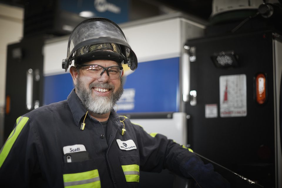 Service technician smiling.