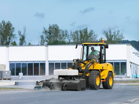 wheel loader with broom attachment