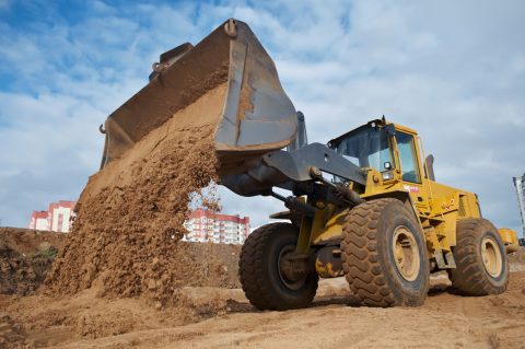 wheel loader unloading sand